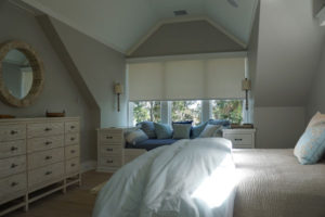 Closed Lutron Roller Shades in a Bedroom