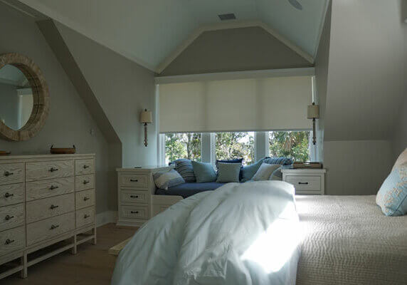 Closed Lutron Roller Shades in a Bluffton Bedroom